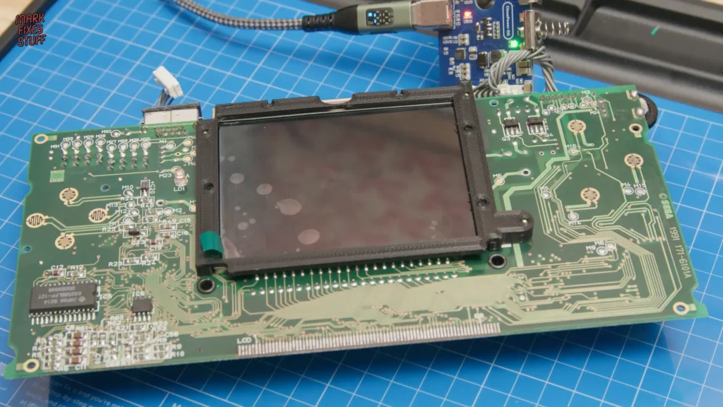 Sega Game Gear motherboard with screen changed and repair work in progress