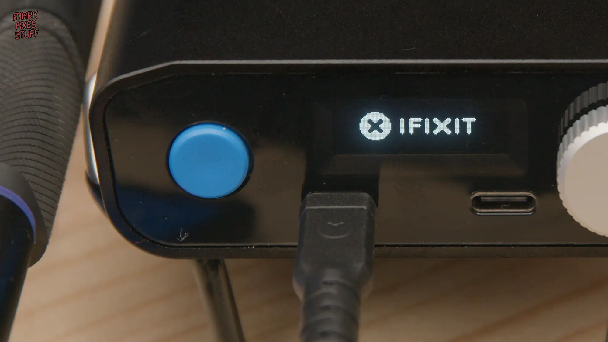 iFixit soldering station close up with power button and USB port for electronics repair