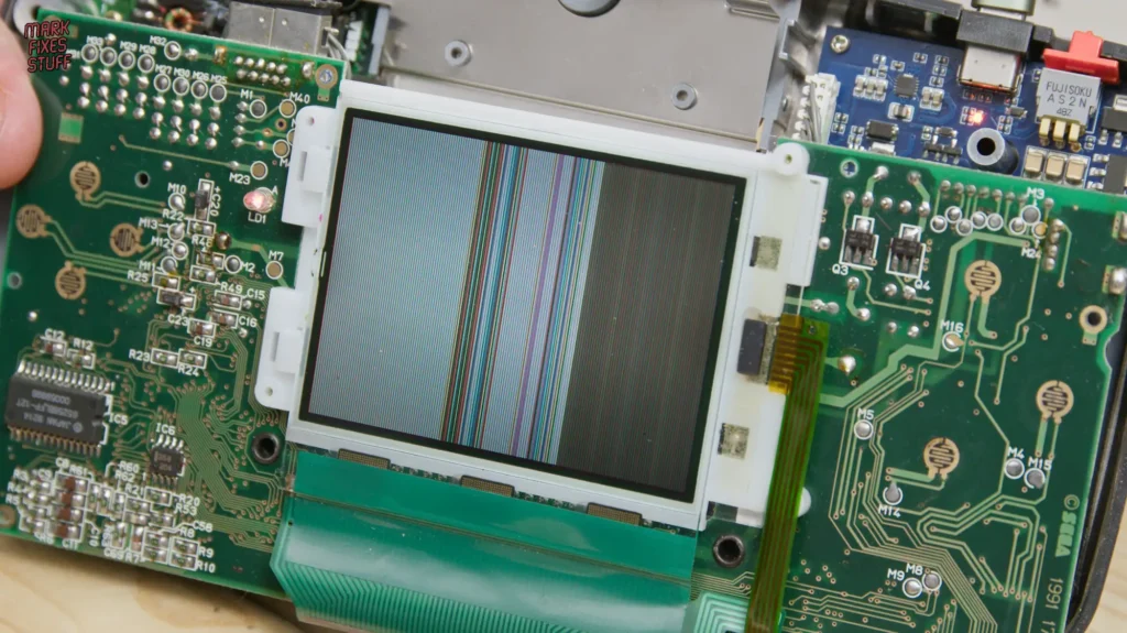 Sega Game Gear screen showing vertical lines fault during repair testing
