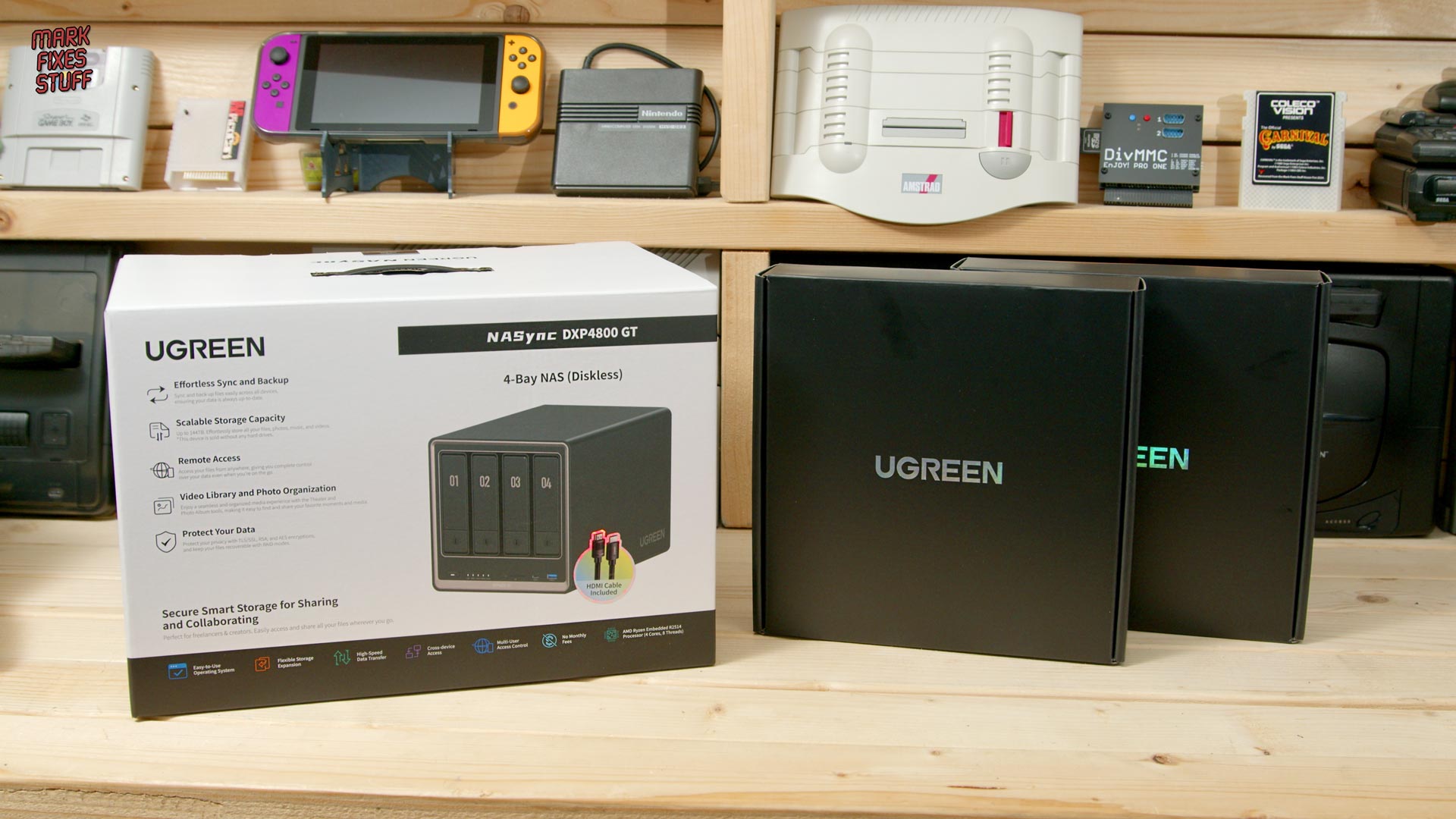 UGREEN NAS DXP4800 GT retail box and packaging on a retro gaming workshop bench before setup