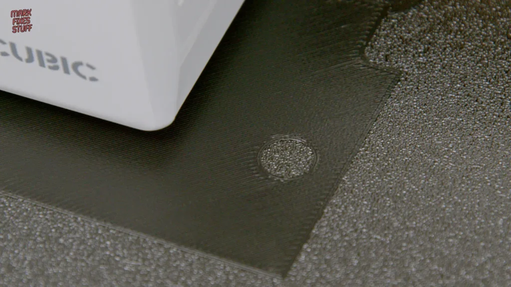 Close-up of a smooth top surface on a 3D printed ColecoVision case showing PEI build plate texture