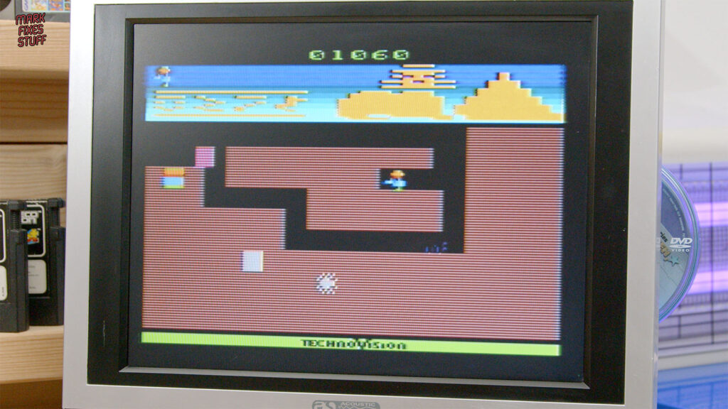 Pharaoh’s Curse gameplay on a television, showing underground passages beneath a desert scene