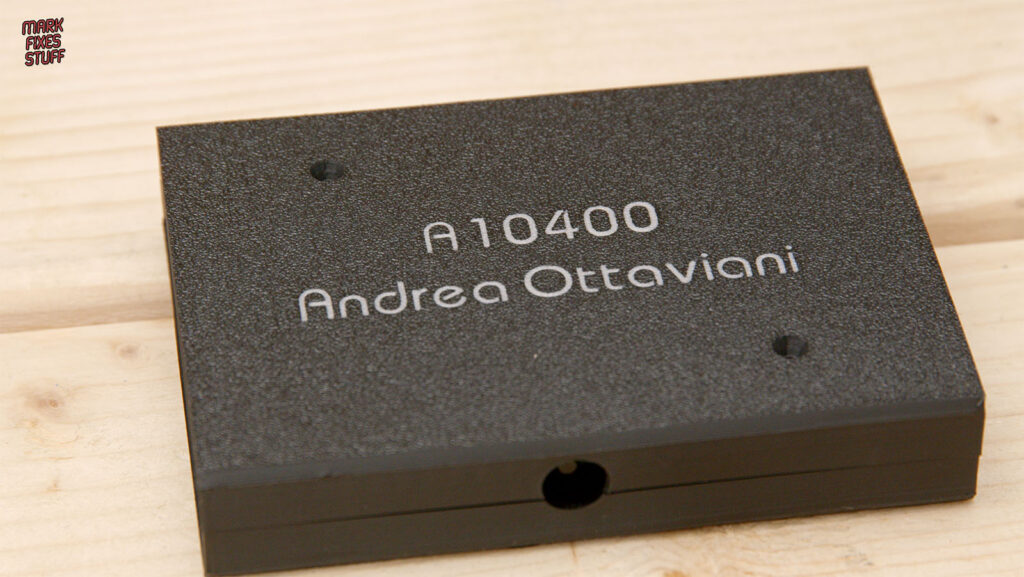 Back of the black cartridge case bearing the text A10400 and Andrea Ottaviani