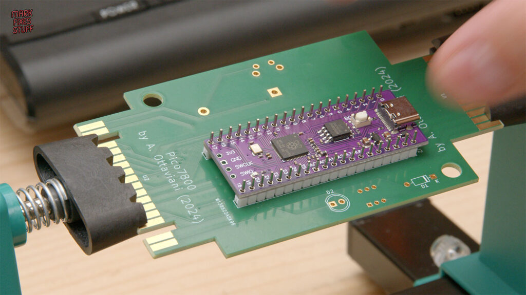 Purple Pico clone mounted on the Pico A10400 circuit board held in a PCB vice